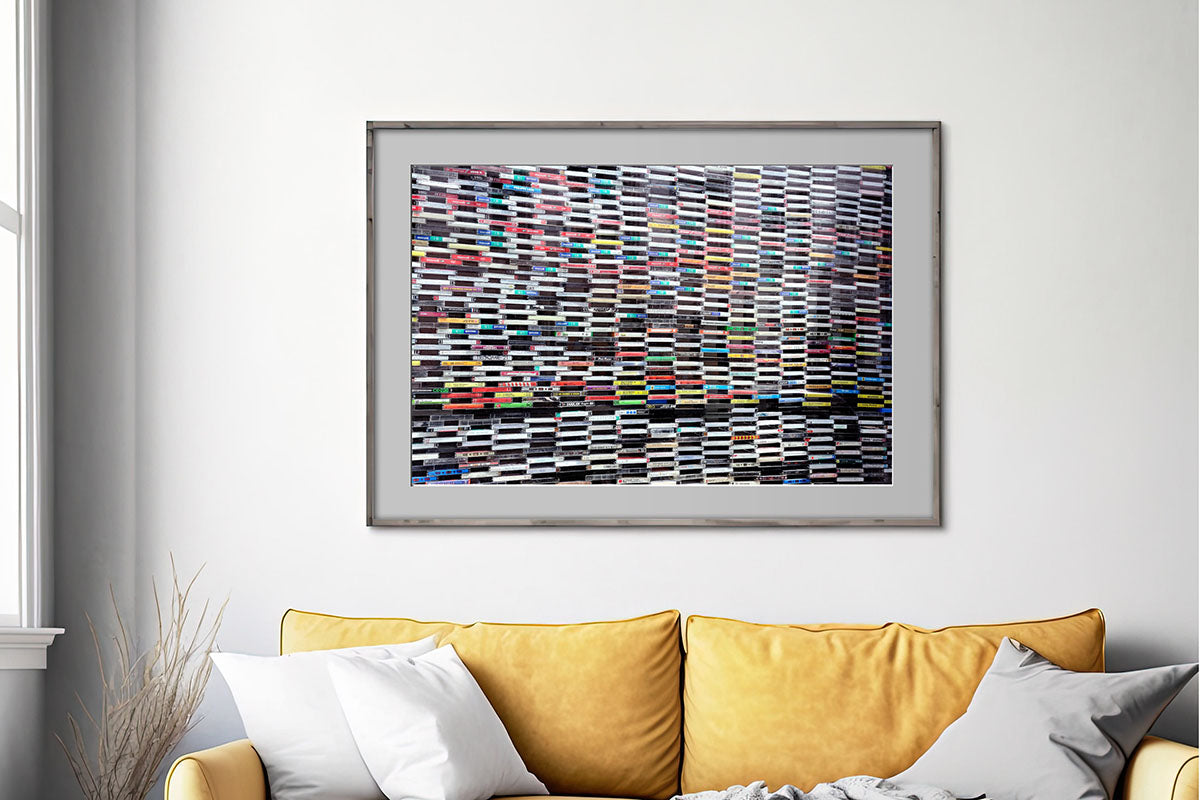 Wall of Sound cassette tapes framed photo in living room no text